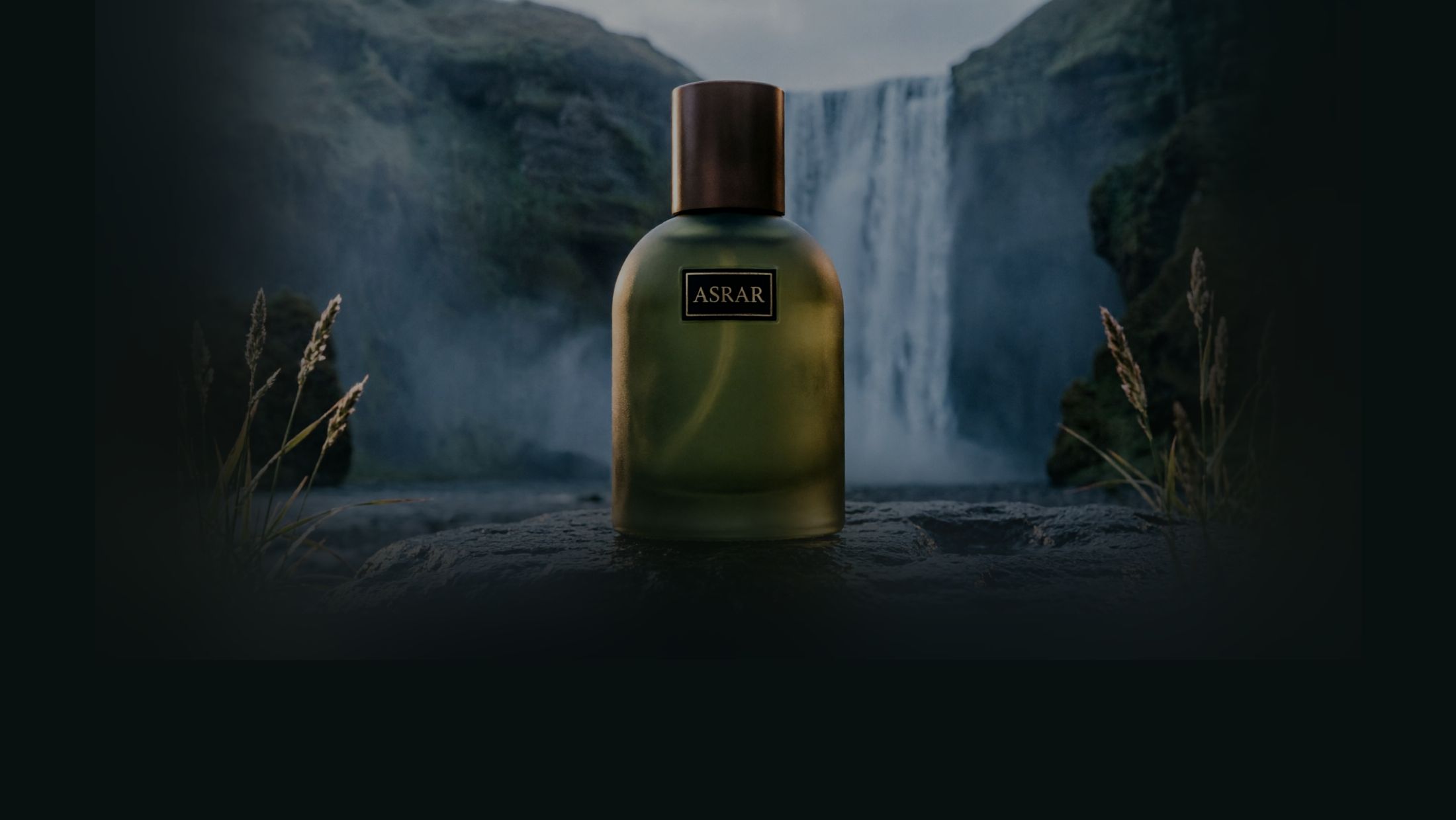 A bottle of Citrus Hadiqa on a wet rock in front of a waterfall
